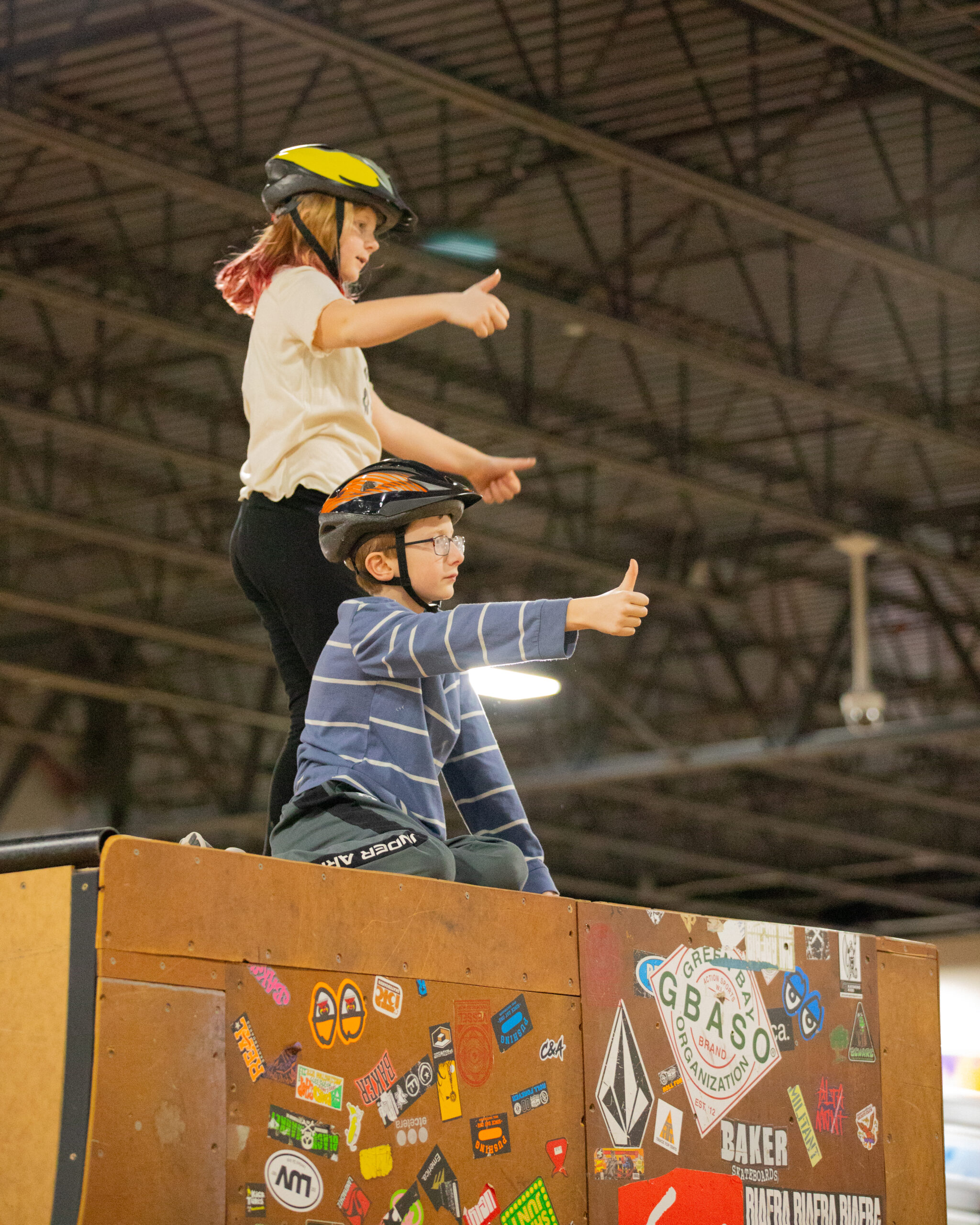 2 kids give the thumbs up to indicate that the box jump is clear for takeoff