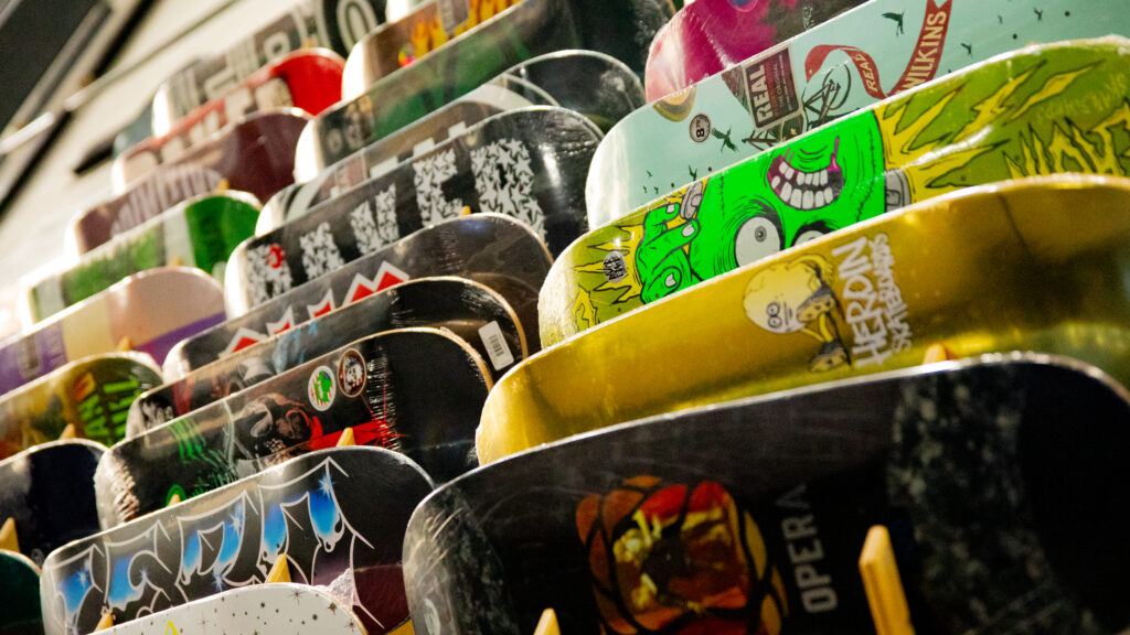 skateboard decks for sale, displayed on the wall at GBASO