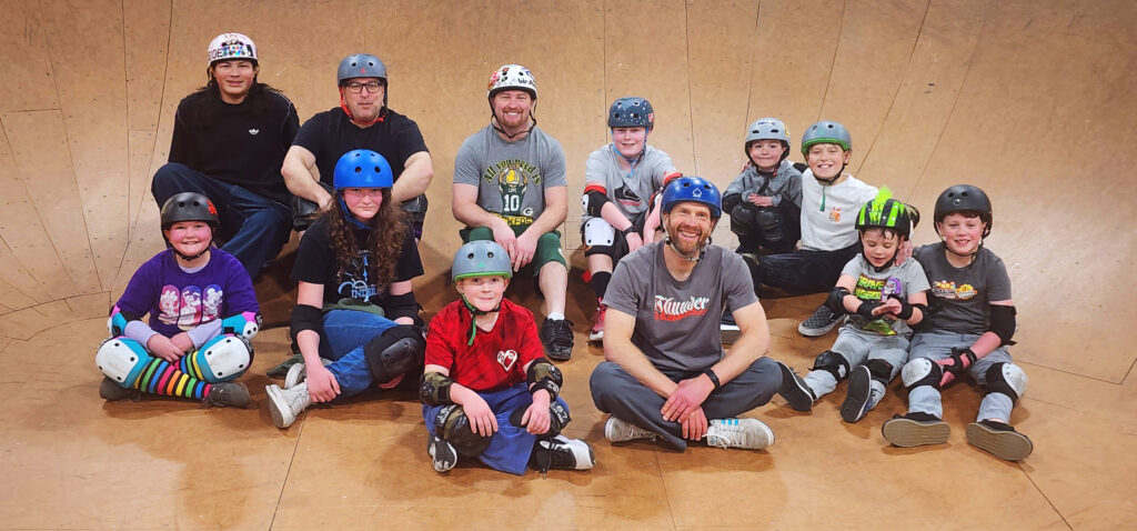 A group photo in the bowl from Skateboarding Class at GBASO